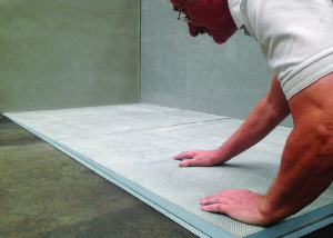 A man installing the Marmox Australia sloping board